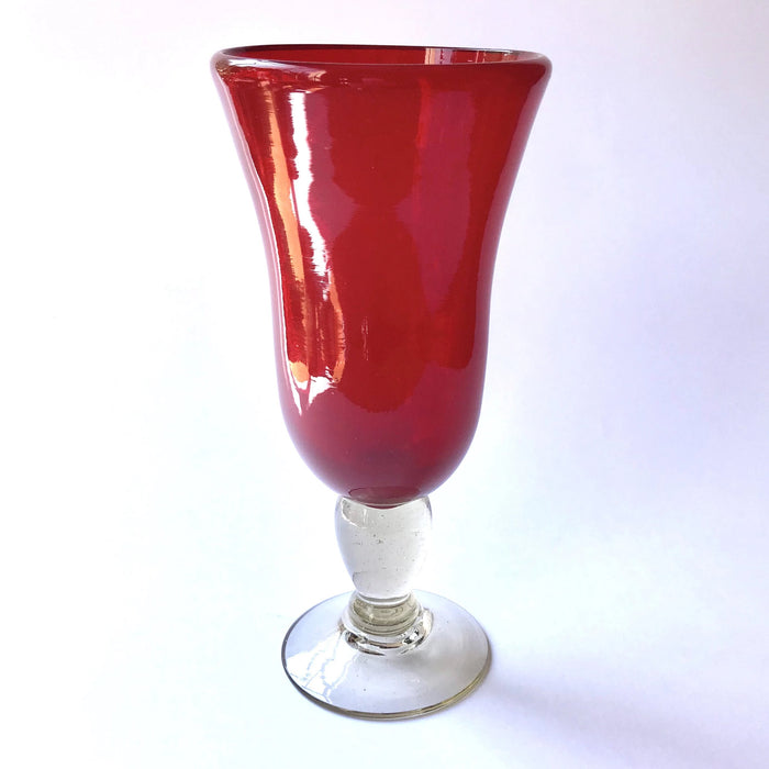 Mexico 1492: Shaped like a colored bell, with a transparent stem and foot, and hundreds of air bubbles reflecting the light, these classic wine glasses are a centerpiece and a conversation starter. Hand made with care, reflecting decades of traditional Mexican glass factories.  Available in Amethyst Purple, Turquoise, Fire Red, Cobalt Blue, Emerald Green, Lime Green and Smoke. 