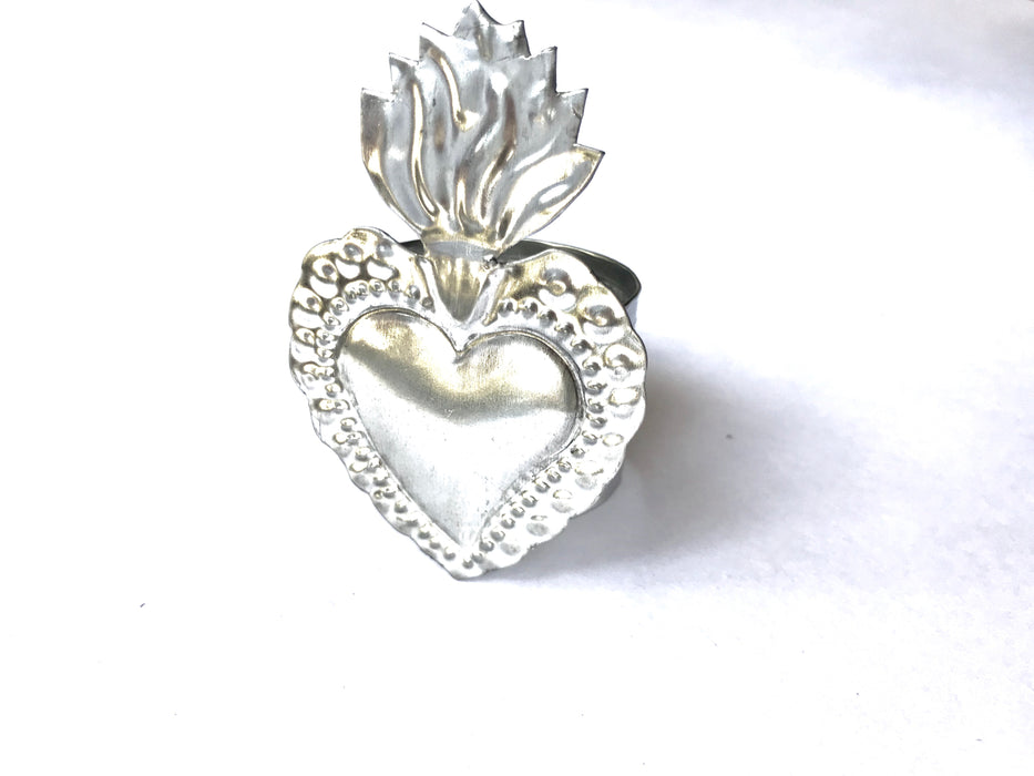 Mexico 1492: Handmade by Oaxacan artisans, using the repujado (embossing) technique, the Sacred Heart napkin holders celebrate one of the most frequently found motifs in the Mexican folk art. Available in 3 charming versions: Thorns, Beams and Flames.