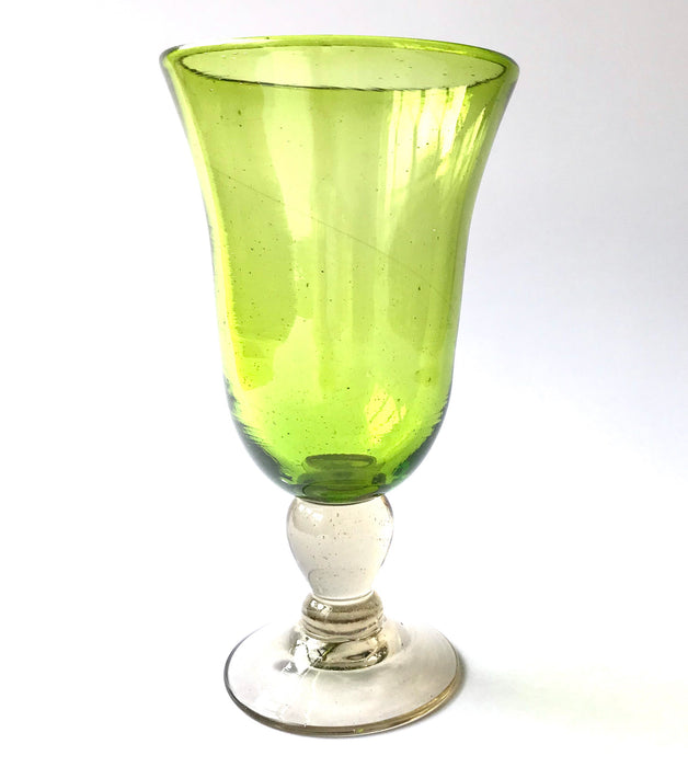 Mexico 1492: Shaped like a colored bell, with a transparent stem and foot, and hundreds of air bubbles reflecting the light, these classic wine glasses are a centerpiece and a conversation starter. Hand made with care, reflecting decades of traditional Mexican glass factories.  Available in Amethyst Purple, Turquoise, Fire Red, Cobalt Blue, Emerald Green, Lime Green and Smoke. 