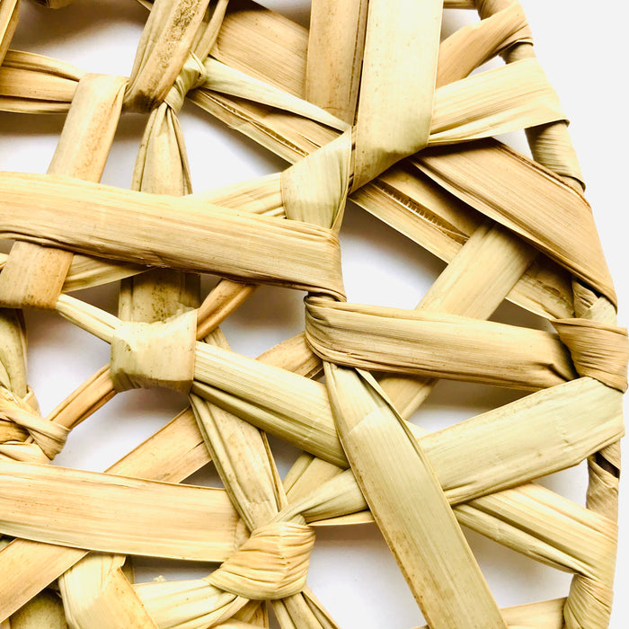 Mexico 1492 - Bulrush fiber, woven as a web on a round metalic frame. A placemat that is beautiful to look at and feels soothing under the fingertips. 