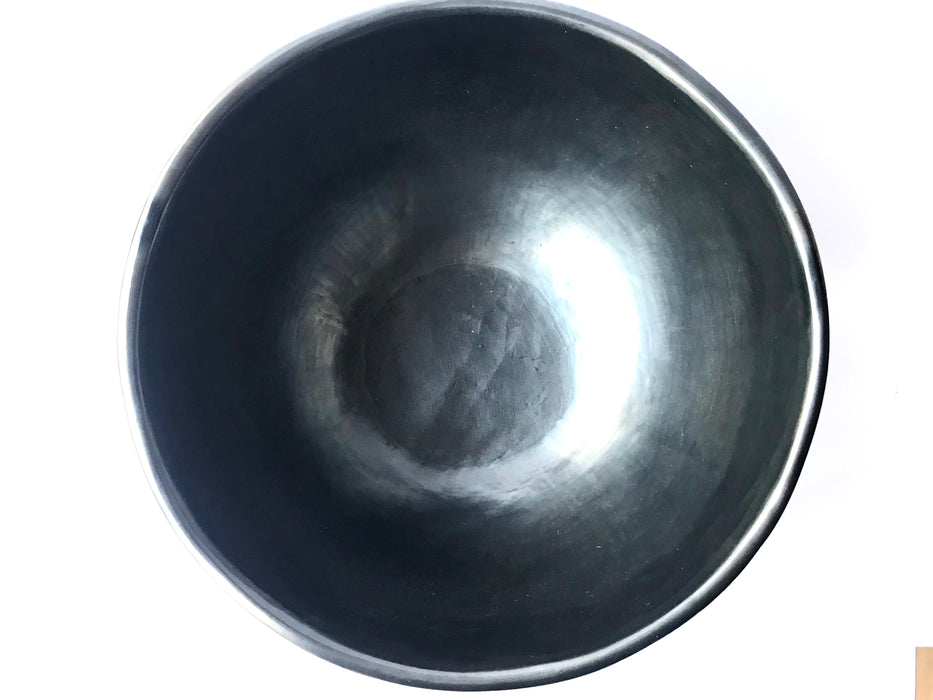 This impressive, handmade, black clay salad bowl from Oaxaca will always be a conversation piece at your dinner. Smooth, shiny black finish. 