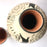 Mexico 1492: The off-white “cántaro” (pitcher), hand made out of clay, hand painted with jewels of the Michoacan nature,  and burnished to shine. Accompanied by a matching glass. Used for storing liquids, like water or wine.   “Cántaro” is a precious piece in every Mexican home, and a favorite way to store water. It is believed that water stays cool in a “cántaro” even on a hottest day.